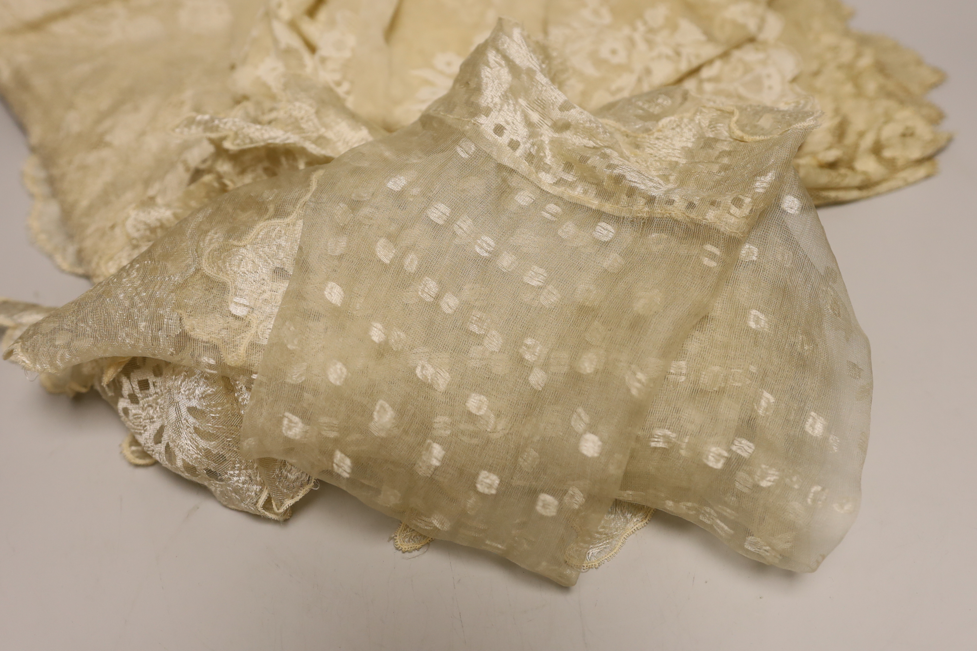 An Irish needle run 19th century lace veil, a machine lace ‘Blonde’ veil and two later cream silk lace stoles